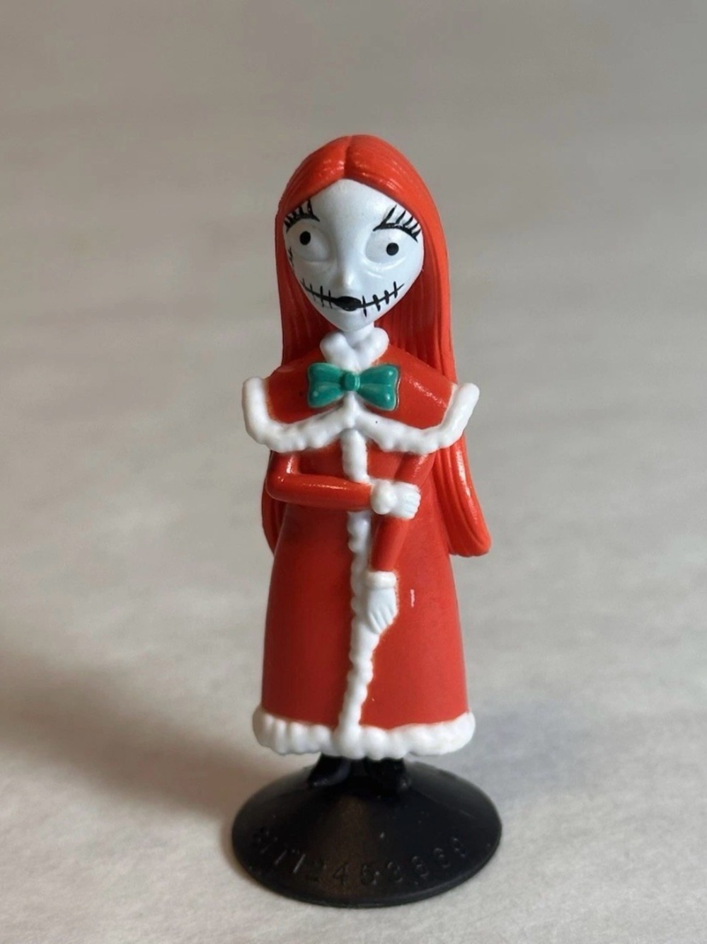 Disney Red Sally Holiday Figurine with White Trim and Green Bow
